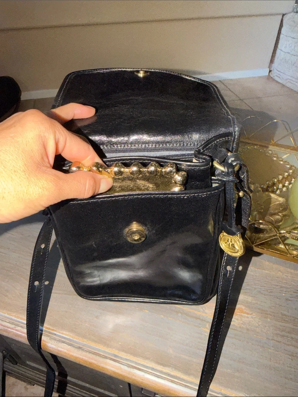 Brahmin Black Leather Messenger Bag with Gold Medallion